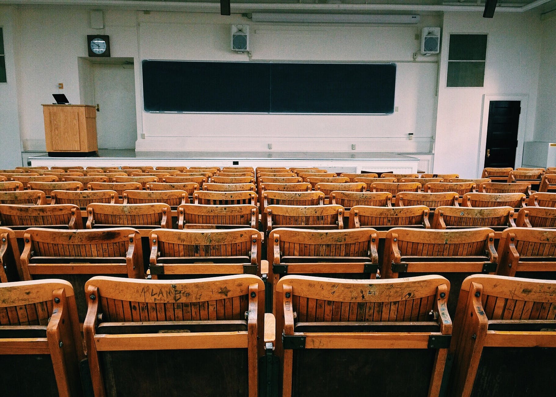 brown and black wooden chairs inside room